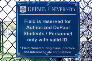 A sign at Wish Field states that the field is reserved for DePaul students and personnel only with a valid id. (Parker Asmann / The DePaulia)