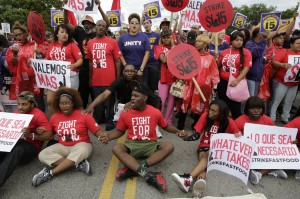 Fast food workers in Chicago block 87th Street in their effort to increase the minimum wage on Sept. 4. Photo courtesy Michael Tercha | Tribune News Service