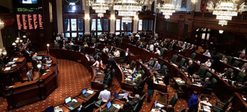 The Illinois House of Representatives during a special session last week. Members voted on legislation to set a 2016 special election for office of comptroller, one of many laws passed over the past year. (Seth Perlman | AP)