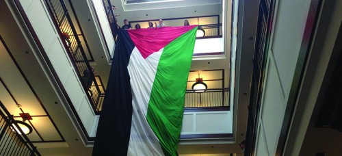 A protest at Arts and Letters Hall May 2014 by Students for Justice in Paletine (SPJ). Students wave the Palestinian flag in support of the DePaul Divest movement. (DePaulia File)