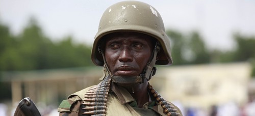 A Nigerian soldier stands guard during Eid al-Fitr prayers in Maiduguri, Nigeria. (Sunday Alamba, File | AP)