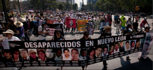 People in Mexico City demonstrate in solidarity for the "disappeared," a number of citizens whom have gone missing in Mexico's War on Drugs, allegedly due both to drug cartels and corrupt police forces. (Marco Ugarte | AP)