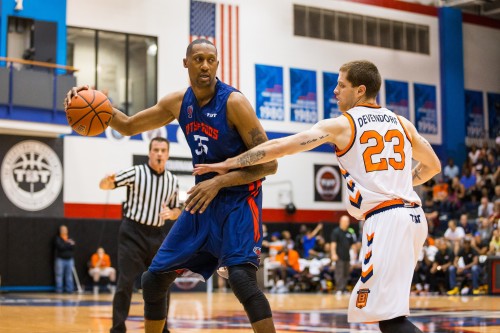 Former NBA forward and Cincinnati star DeMarr Johnson (left) posts up Boeheim's Army Saturday at McGrath-Phillips Arena. Johnson played for City of Gods in The Tournament, a single-elimination tournament for a chance at $1 million. 