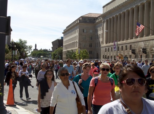 Thousands flood 15th Avenue moments after the pope mobile exited the parade route Wednesday morning. Many visitors continued on to the Cathedral of St. Matthew the Apostle and the Basilica of the National Shrine at the Catholic University of America to catch more glimpses of Pope Francis. 