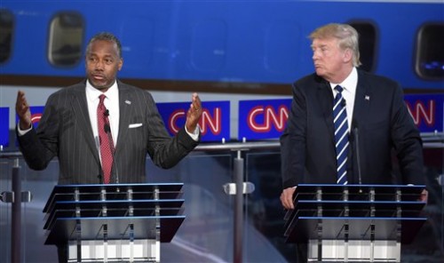 Republican presidential candidate Ben Carson, left, speaks as Donald Trump looks on during the CNN Republican presidential debate at the Ronald Reagan Presidential Library and Museum on Wednesday, Sept. 16, 2015, in Simi Valley, California. (AP Photo/Mark J. Terrill)