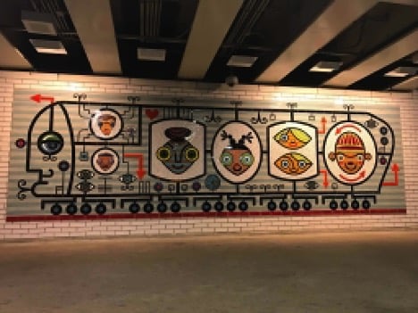 Artist David Lee Csicsko crated the mosaic located at the Belmont train stop.