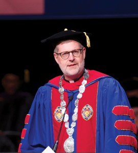 The Rev. Dennis H. Holtschneider, C.M., president of DePaul University address the audience during the College of Law commencement May 18, 2014 at the Rosemont Theatre in Rosemont, IL. (DePaul University/Jeff Carrion)