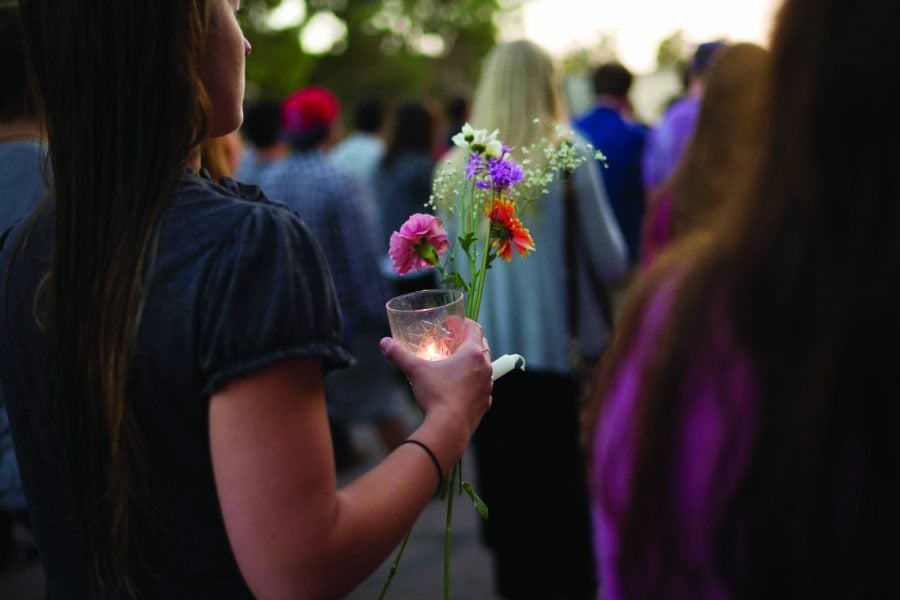 People march on the campus of the University of California Santa Barbara during a candlelight vigil held to honor the victims of the mass shooting. Photo courtesy of AP.