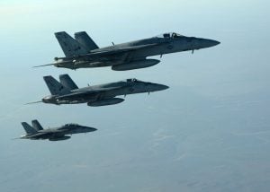 In this Tuesday, Sept. 23 photo released by the U.S. Air Force, a formation of U.S. Navy F-18E Super Hornets leaves after receiving fuel over northern Iraq, as part of U.S. led coalition airstrikes on the Islamic State group and other targets in Syria. Photo by Shaun Nickel/AP Exchange