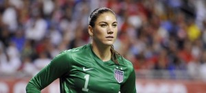 In this Oct. 20, 2013, file photo, United States goalkeeper Hope Solo pauses on the field during the second half of an international friendly women's soccer match against Australia in San Antonio. U.S. Soccer is standing by its decision to allow goalkeeper Hope Solo to continue to play while she faces domestic violence charges, Tuesday, Sept. 23, 2014. (AP Photo/Darren Abate, File)