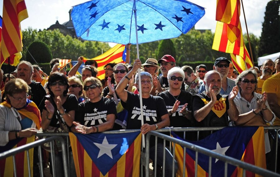 Spanish Catalans show their support for independence from Spain. Photo by Manu Fernandez/AP.