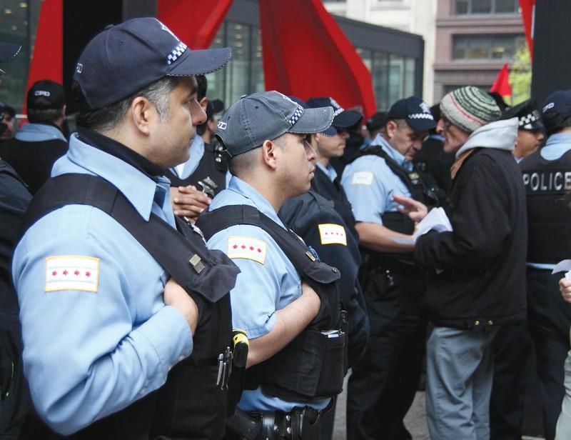 Chicago police officers gather in the Dirksen Federal Building Plaza. The organization is open to
emerging ideas about the inclusion of body cameras on officers. (Photo courtesy of ALLAN J. AGUILAR)
