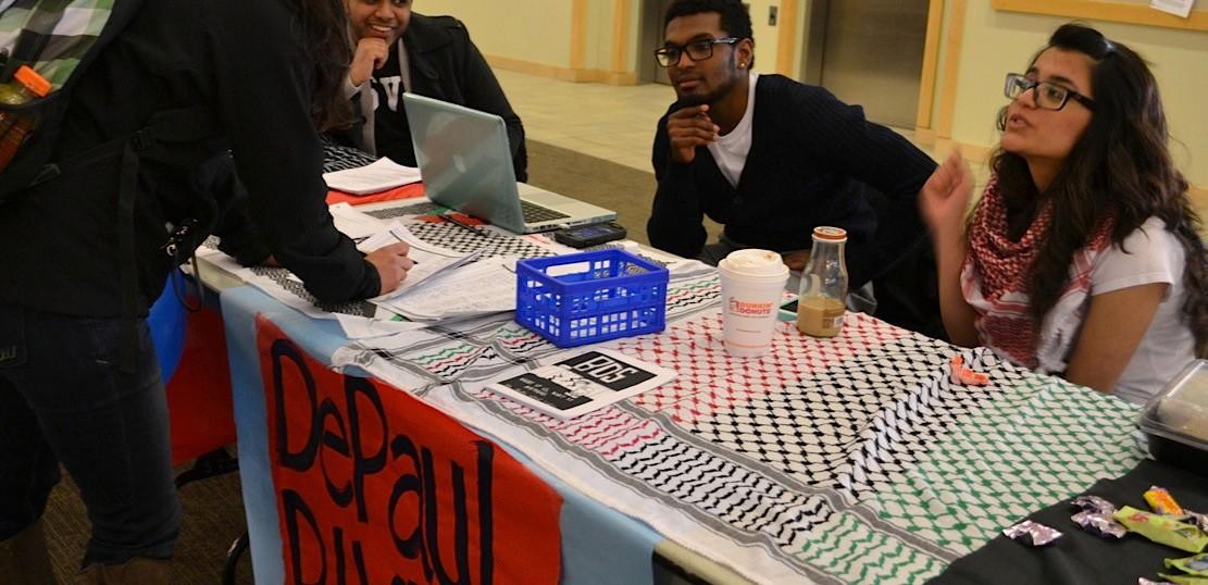 Members of Depaul Divests explaining the process of divestment from companies that
supposedly profit off of Israel's occupation of Palestine. Controversy has surrounded
the measure, which is set to be voted on in the SGA elections, May 19-May 22. (Photo courtesy of DePaul Students for Justice in Palestine)