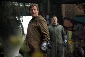 Bryan Cranston, left, and Aaron Taylor-Johnson in the most recent film adaptation of "Godzilla," the giant lizard monster that has been central to several movies in past decades. (Photo courtesy of Warner Bros. Entertainment)