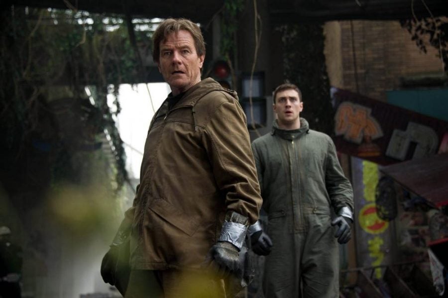 Bryan Cranston, left, and Aaron Taylor-Johnson in the most recent film adaptation of Godzilla, the giant lizard monster that has been central to several movies in past decades. (Photo courtesy of Warner Bros. Entertainment)