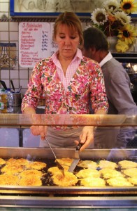 Reibekuchen (fried potato pancakes) draw you in with their savory smell and are a staple to cold-weather markets. (Megan Deppen / The DePaulia)