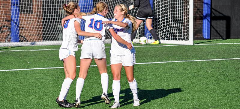 Amber Paul embraces junior Elise Wyatt after a goal against Creighton Saturday Oct. 11 in a 2-0 victory. (Maggie Gallagher / The DePaulia)