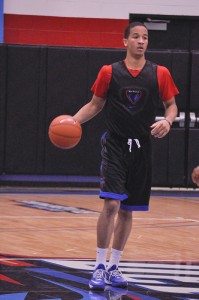 DePaul guard Billy Garrett Jr. dribbles the ball. (Maggie Gallagher / The DePaulia)