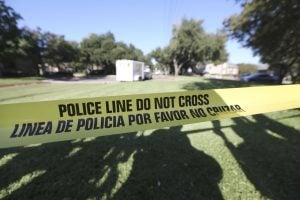 A police line tape marks where the media is set up to watch The Village Bend East apartments where a second healthcare worker lives that tested positive for Ebola, Wednesday, Oct. 15, 2014, in Dallas. Photo courtesy AP.