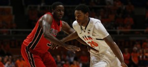 Former Illinois and current Blue Demon forward Myke Henry (20) drives the ball around Gardner-Webb’s Jerome Hill (35) during the game at Assembly Hall on  Nov. 25, 2012. (Photo courtesy of Brenton Tse / The Daily Illini)