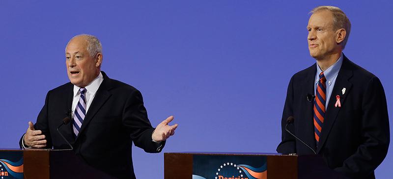 Gov. Pat Quinn and Bruce Rauner debate in Peoria a few weeks ago. Experts have deemed this race too close to call. Over the past few weeks, every poll has shown a statistical tie. (Seth Perlman | AP)