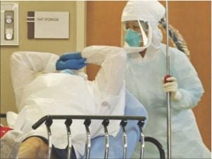 A patient in Dallas is treated because of possible signs of Ebola exposure. LOUIS DELUCA | AP / THE DALLAS MORNING NEWS