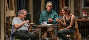 Ensamble members Francis Guinan and Tim Hopper with Helen Sadler in "The Night Alive." (Michael Brosilow / Steppenwolf Theatre)
