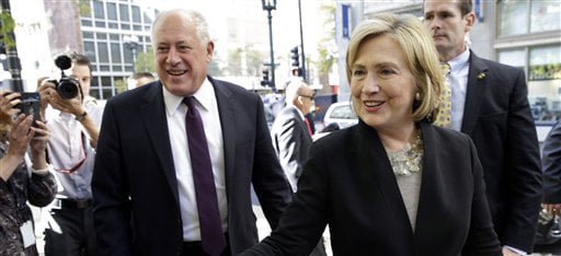 Former U.S. Secretary of State Hillary Rodham Clinton, right, and Illinois Gov. Pat Quinn, left, talk with supporters  as they arrive at a Barnes & Noble bookstore in Chicago Wednesday, Oct. 8, 2014. Clinton visited Chicago for two appearances, including a speech to a business group, and she is expected to stump for Quinn in his bid for re-election. (AP Photo/ Nam Y. Huh)