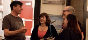 Collin Cordell (left) speaks with patrons enjoying some alcoholic beverages. Cordell owns The Red Lion Pub in Lincoln Park. One of his lifelong passions is bartending. (PMonaghan | Creative Commons)