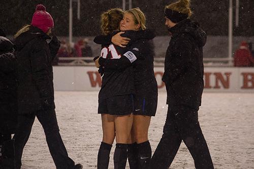 Junior captain Elise Wyatt hugs sophomore Abby Reed after their loss to Wisconsin. (Grant Myatt / The DePaulia)