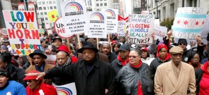 Rev. Jesse Jackson, Chicago Teachers Union President Karen Lewis and Congressman Bobby Rush (D-Chicago) lead a protest the closing of nearly 50 CPS schools in 2013. Many CPS schools are under resourced, especially in comparison to wealthier suburban districts. (Charles Rex Arbogast | AP)