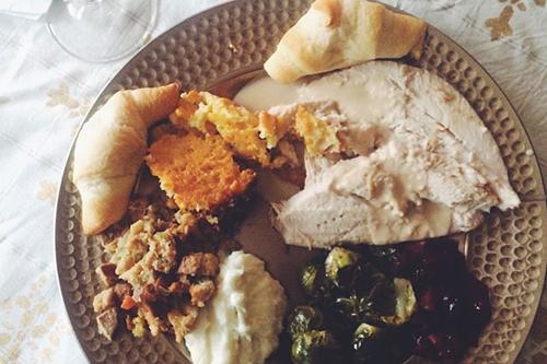 My Thanksgiving plate included: turkey, garlic mashed potatoes, stuffing, roasted Brussles sprouts, cranberries with walnuts, spoonbread and cresent rolls (you cant make everything from scratch).