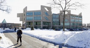 In this Feb. 7, 2014 file photo, a student walks on the campus of Chicago State University in Chicago. Four universities in Chicago, New York and Honolulu are trying to outdo one another as they compete to host Barack Obama's future presidential library. (AP Photo/M. Spencer Green,File)