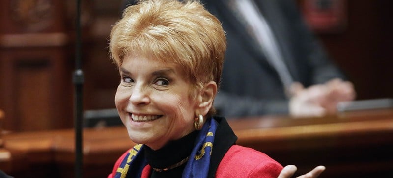 In this March 6, 2013 file photo, Illinois Comptroller Judy Baar Topinka gestures on the House floor at the state Capitol in Springfield, Ill. Topinka, who won a second term in November 2014, died early Wednesday morning, Dec. 10, 2014, less than 24 hours after having a stroke, according to her office. She was 70. Topinka previously served three terms as Illinois state treasurer, was a former Illinois GOP chairwoman and ran for governor in 2006. (AP Photo/Seth Perlman, File)