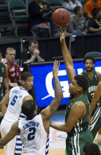 Ohio guard Antonio Campbell, right, shoots the basketball while being defended by DePaul center Tommy Hamilton IV (2) in the first half of an NCAA college basketball game at the Diamond Head Classic on Tuesday, Dec. 23, 2014, in Honolulu. DePaul guard Billy Garrett Jr. (5) looks on during the play. (AP/Photo Eugene Tanner)