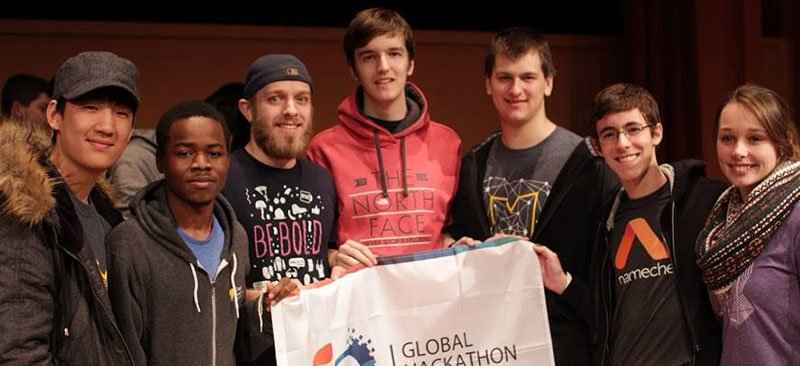 (L-R) Students Wilfried Hounyo, Matt Kula, Stafan Aleksic, Peter Szczepanski, and Raphael Rouvinov placed second in the University of Michigan hackathon. (Photo courtesy of MHacks)