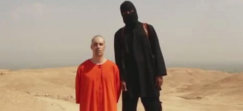 This image from a video released by Islamic State militants on Aug. 19, shows journalist James Foley before his killing by Islamic State militants. (AP File Photo)