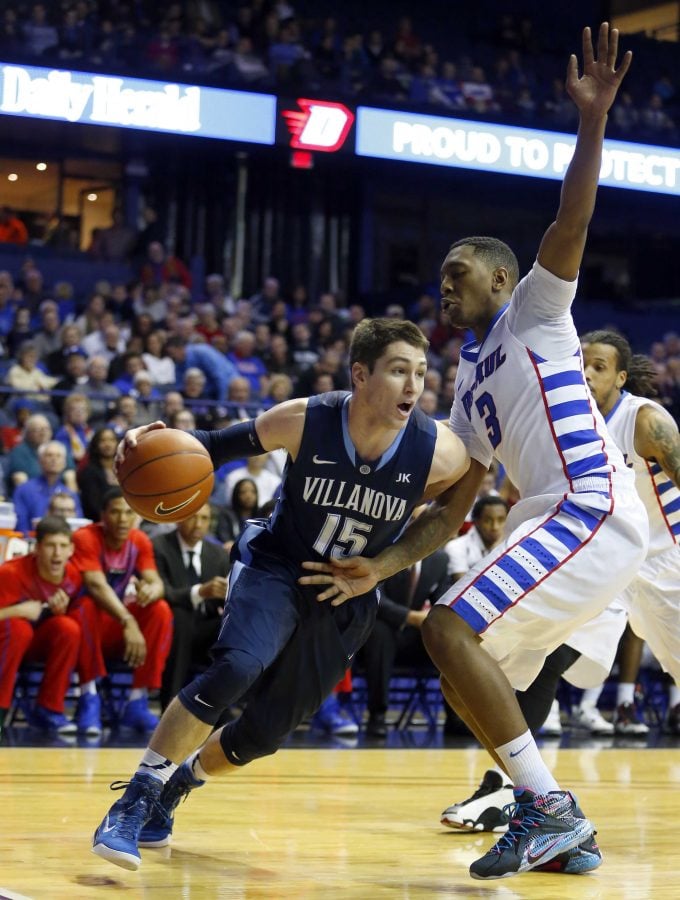 Villanova guard Ryan Arcidiacono (15) dribbles past DePaul forward Rashaun Stimage (3) during the first half of an NCAA college basketball game, Saturday, Jan. 31, 2015, in Rosemont, Ill. (AP Photo/Jeff Haynes)