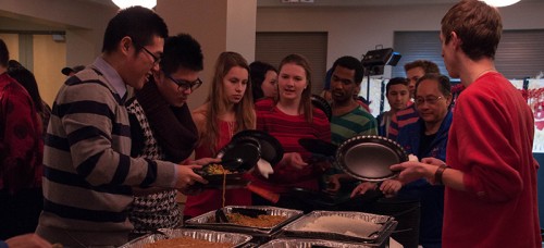 Students sample food catered from Sweet Station, a restaurant from Chinatown. (Maggie Gallagher / The DePaulia)