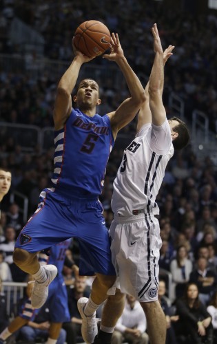 DePaul's Billy Garrett Jr. (5) puts up a shot against Butler's Alex Barlow (3) during the second half of an NCAA college basketball game, Saturday, Feb. 7, 2015, in Indianapolis. Butler won 83-73. (AP Photo/Darron Cummings)