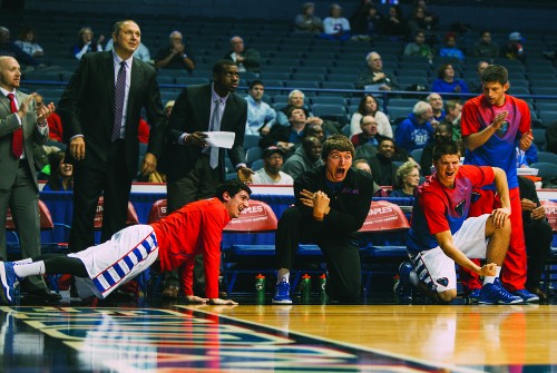 From left: Cory Dolins, Peter Ryckbosch, Joe Hanel, and David Molinari, the Bench Mob, watch as the Blue Demons took on Seton Hall last Tuesday. The Demons won 75-62.