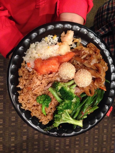 The meal included beef and broccoli, orange chicken, fortune cookies, la dofu, chow main and sesame balls. (Lauren Awtry / The DePaulia)