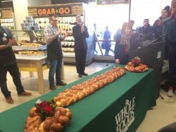 Alderman Michele Smith and DePaul President Rev. Dennis H. Holtschneider, C.M. welcome Whole Foods to the community. The traditional bread breaking ceremony for Whole Foods took place at 9 a.m. Wednesday morning before guests could begin shopping. (Grant Myatt / The DePaulia)