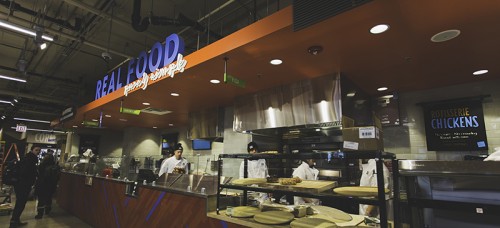 Employees at the new Whole Foods DePaul location prepare for the store’s opening Wednesday, Feb. 25. This is one of the first Whole Foods to open in a former Dominick’s location. (Josh Leff / The DePaulia)