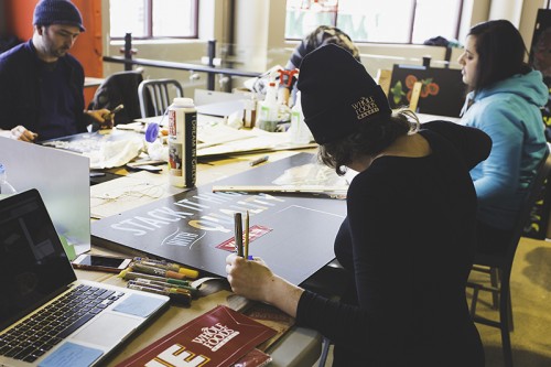 An artist works on one of the handmade signs for the new Whole Foods Market DePaul location at 959 W. Fullerton Ave. Each Whole Foods location is customized specifically for the demands of the community that it’s located in. (Josh Leff / The DePaulia)