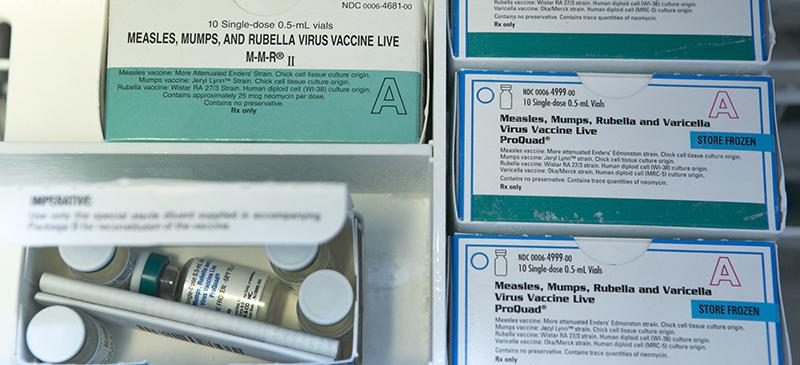 Boxes of the measles, mumps and rubella virus vaccine (MMR) and measles, mumps, rubella and varicella vaccine inside a freezer at a doctor’s office. (AP Photo/Damian Dovarganes, File)