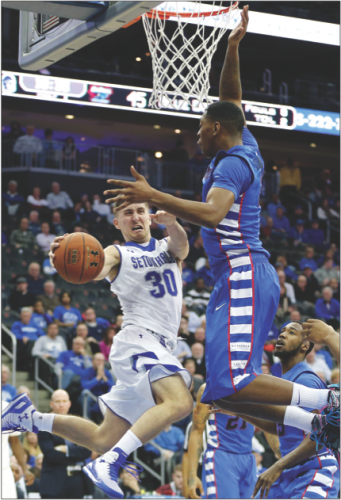 Junior forward Rashaun Stimage displays an impressive vertical in protecting the rim against Seton Hall in a 64-60 win Jan. 22. Stimage missed the first 15 games this season with a broken right foot. (Julio Cortez | AP)