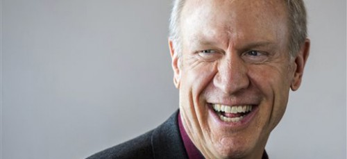 Illinois Gov. Bruce Rauner smiles as a crowd gives him a standing ovation as he speaks at a Peoria Chamber of Commerce event in Peoria, Illinois, Friday, Feb. 6. (Fred Zwicky | AP)