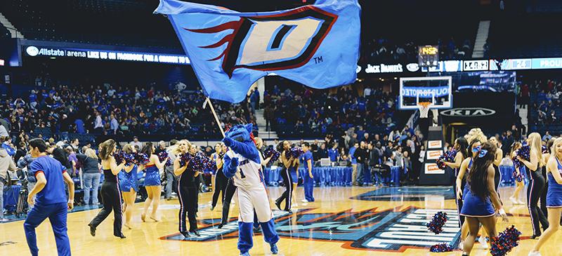 DIBS flies the Blue Demon flag at the men’s basketball game. (Garrett Duncan / The DePaulia)