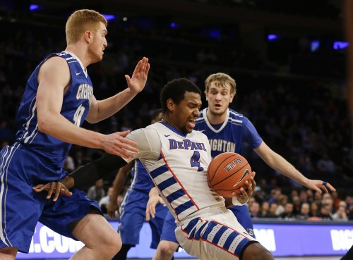 DePaul's Myke Henry (4) regains control of the ball as Creighton's Geoffrey Groselle (41) and Toby Hegner (32) defend during the first half of an NCAA college basketball game in the first round of the Big East Conference tournament, Wednesday, March 11, 2015, in New York.  (AP Photo/Frank Franklin II)